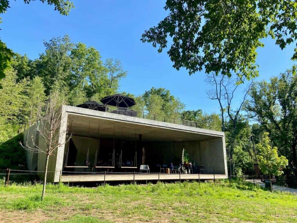 Open-air rectangle concrete building housing Airship Coffee in Coler Preserve 