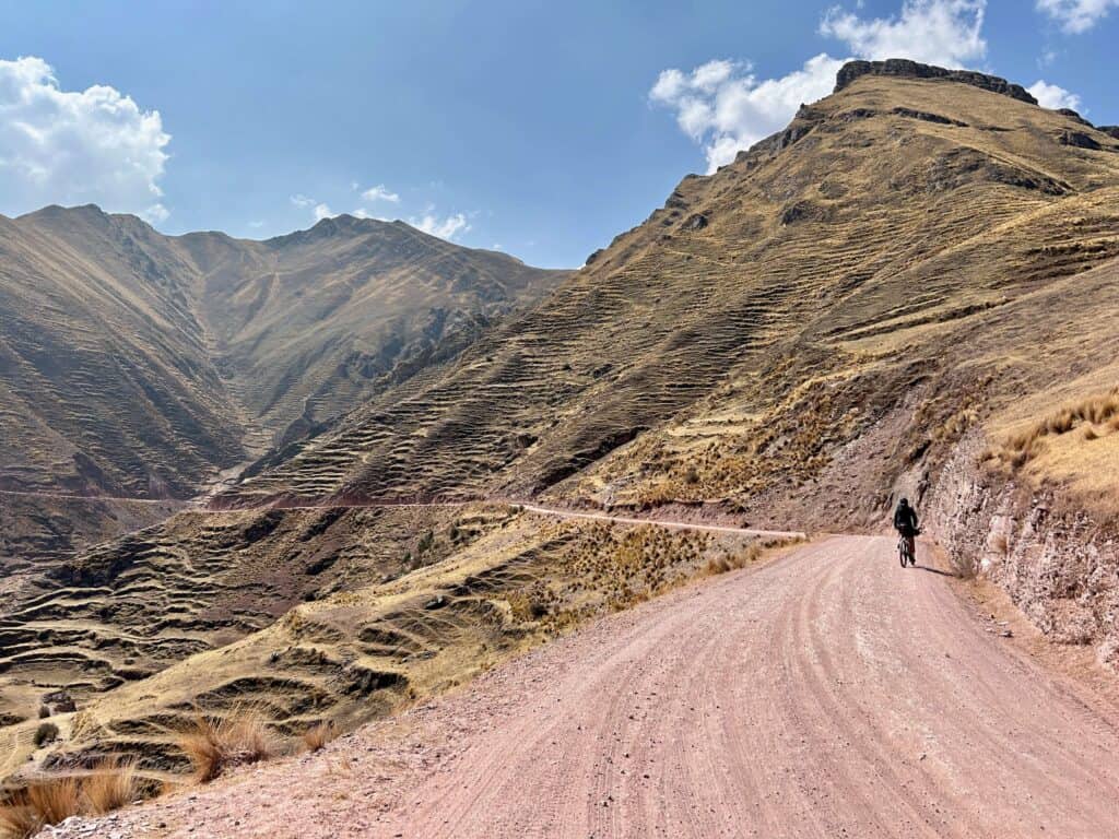 Mountain biker on remote dirt road in the Andes in Peru