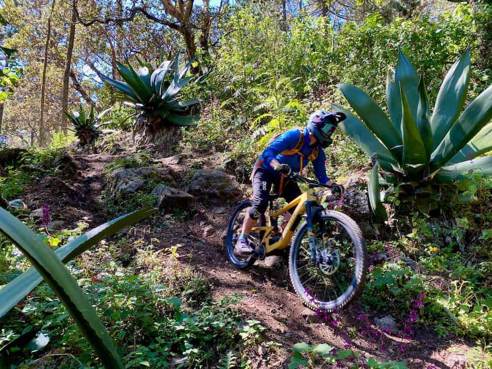 Mountain biker riding down steep rock section of trail in Oaxaca, Mexico