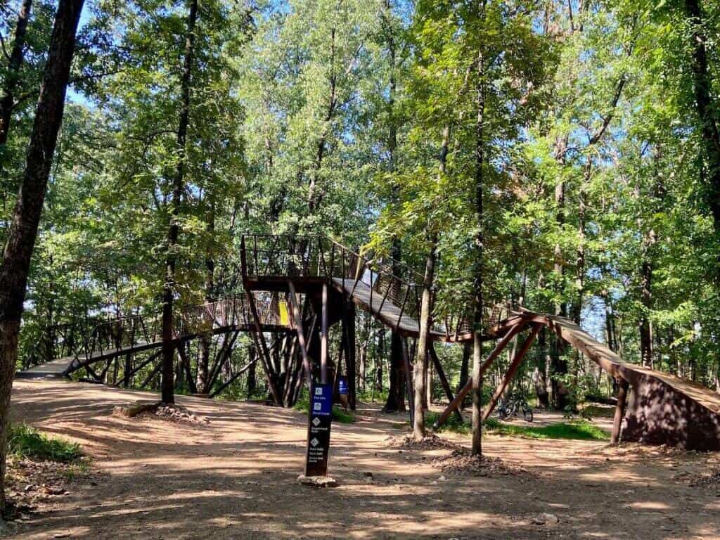 The Hub at Coler Preserve: an elevated platform with ramps leading into three different mountain bike trails