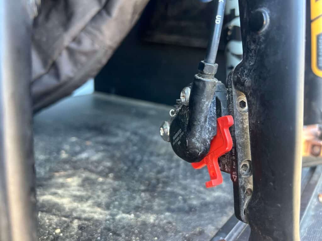 Bike brake spacer in between brake pads