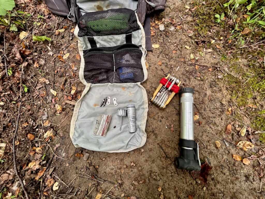 Mountain bike tools laid out on trail